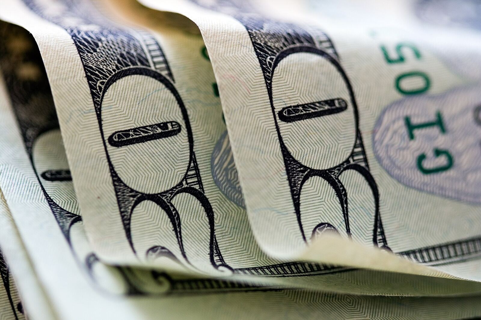 Eight Dollar Bill | Love Hurtz Close-up of an eight dollar bill raised at a fundraising event for Love Hurtz.